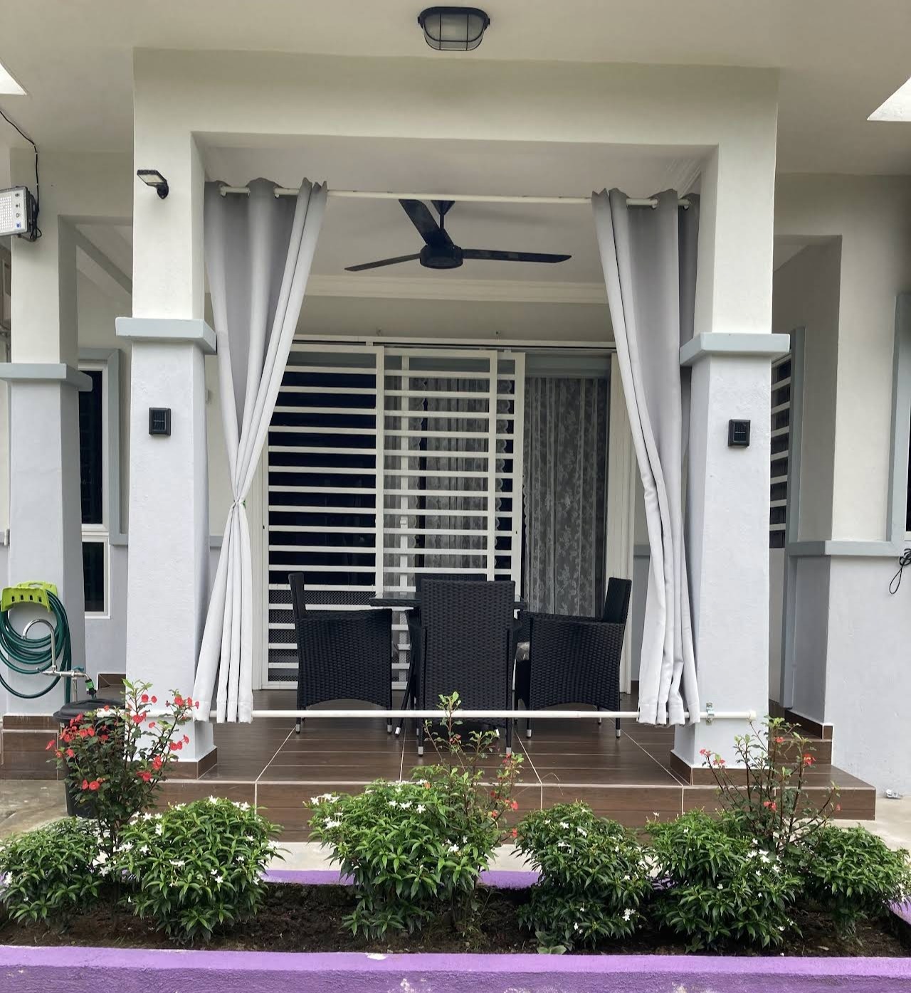 Covered porch with rattan dining set